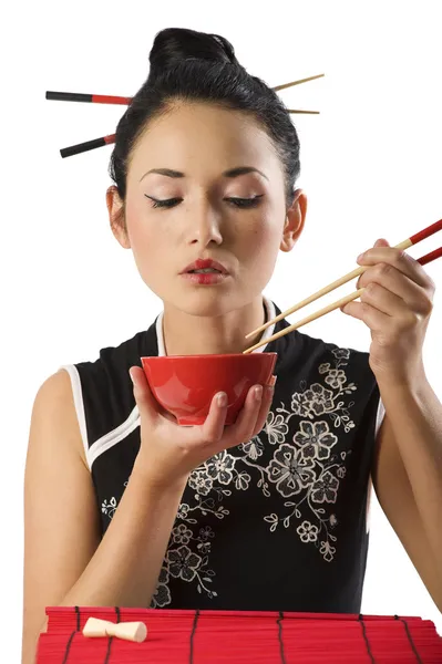 Girl eating oriental food — Stock Photo, Image