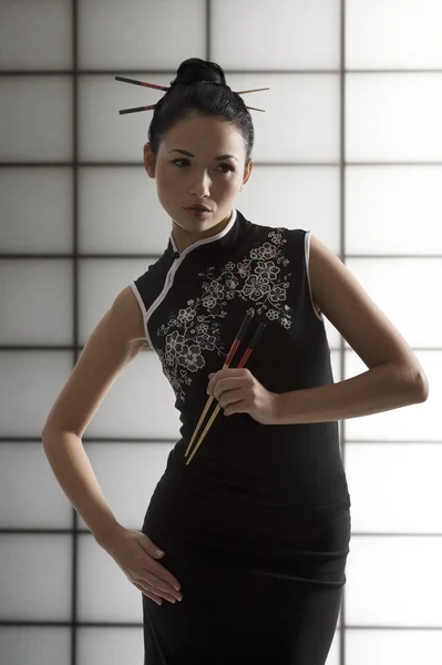 Oriental girl with chopstick — Stock Photo, Image