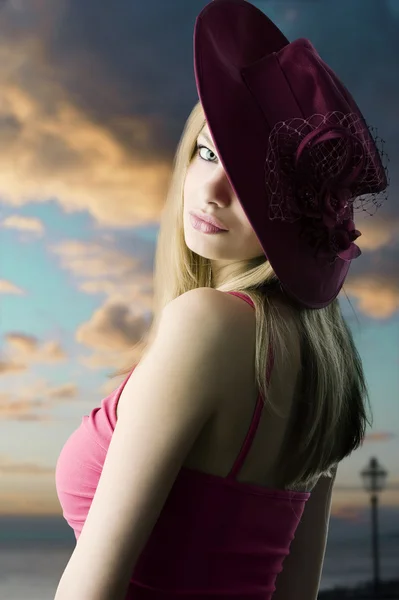 Blond girl and red hat — Stock Photo, Image