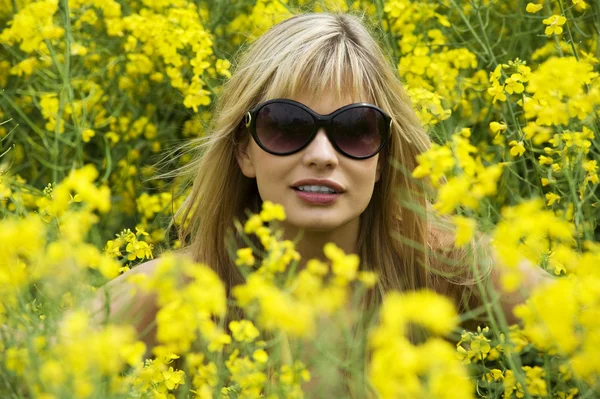 Cute Young Blond Woman Outdoor Yellow Field Wearing Sun Glasses — 스톡 사진