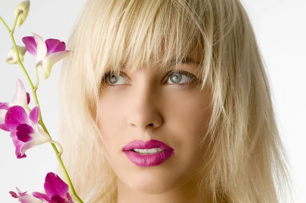 Roze lippen en bloem — Stockfoto