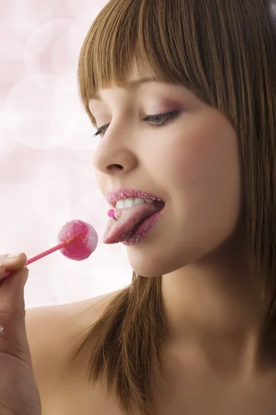 Liking lollipop — стоковое фото