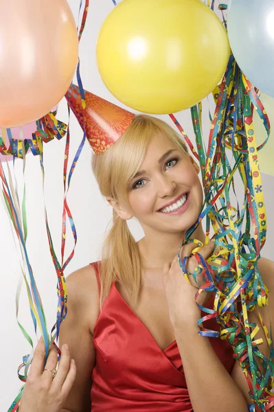 Pretty Blond Woman Red Dress Funny Hat Balloons Colored Ribbons — Stock Fotó