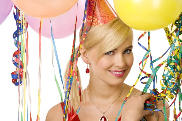 Smiling girl in party with balloons — Stock Photo, Image