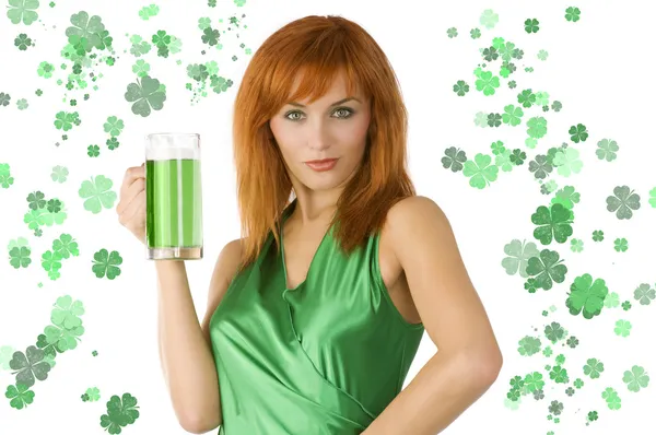 stock image redhead Irish Lass posing in green dress with glass of green beer