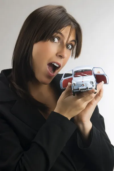 Young Cute Brunette Looking Camera Surprise Showing Model Italian Car — Stock Photo, Image