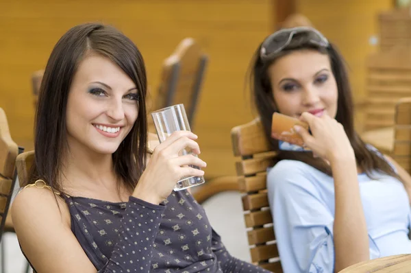 Two Girls Relaxing Pub Hard Day Spent Shopping Showing Credit — Stock Photo, Image