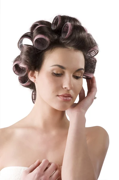 Женщина с катками для волос — стоковое фото