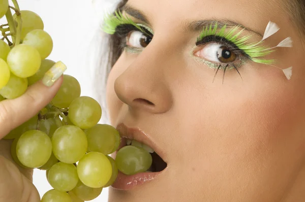 The lip and the grape — Stock Photo, Image