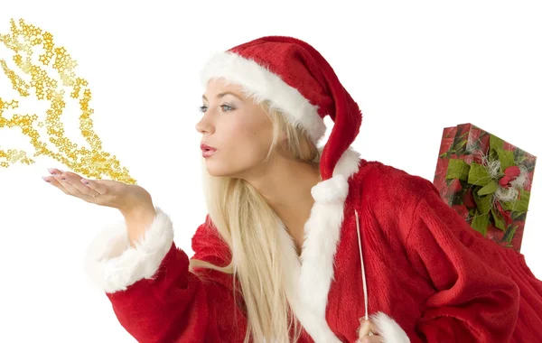 Close Van Een Blond Kerstman Blazen Sterren Stof Hand — Stockfoto