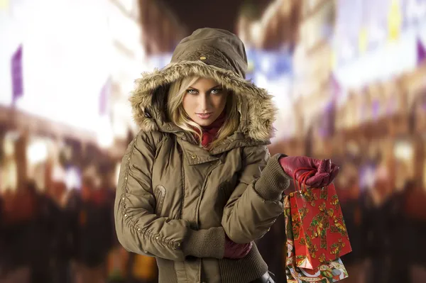 Girl in jacket winter with shopping bag — Stock Photo, Image
