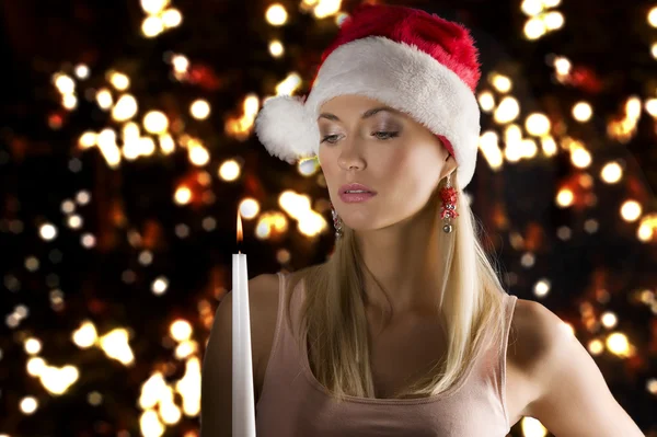 Girl santa claus with candle — Stock Photo, Image