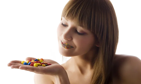 Smarties and girl Royalty Free Stock Photos