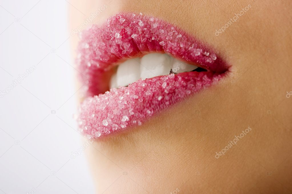 Closeup of woman sugar lips