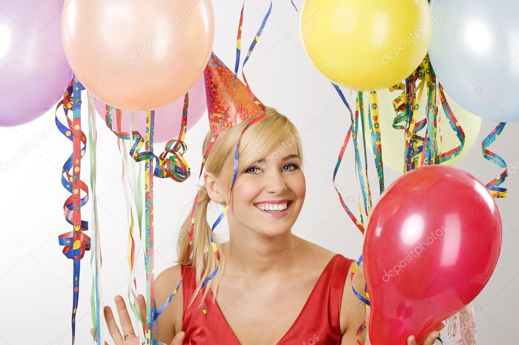 Red dressed girl in party with balloons