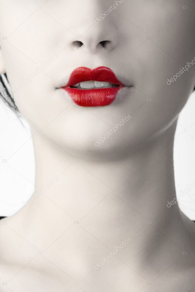 desaturate color portrait of woman with classic red japanese make up on her lips