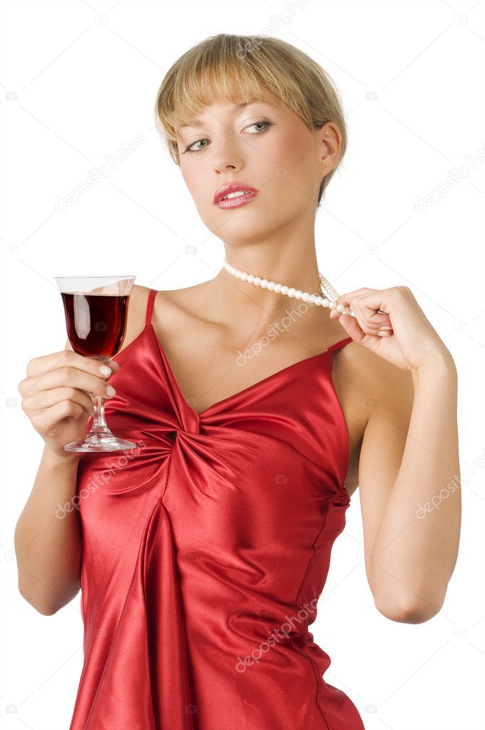 stylish blond girl with pearl necklace drinking a glass of red wine