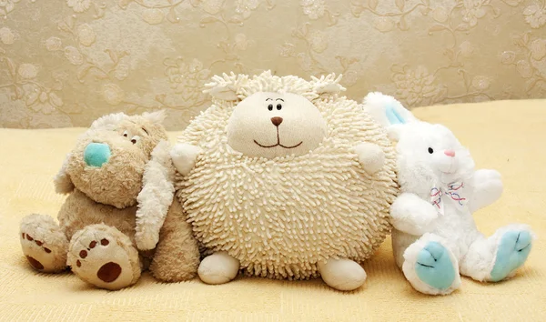 Toy puppy, leveret and doll — Stock Photo, Image