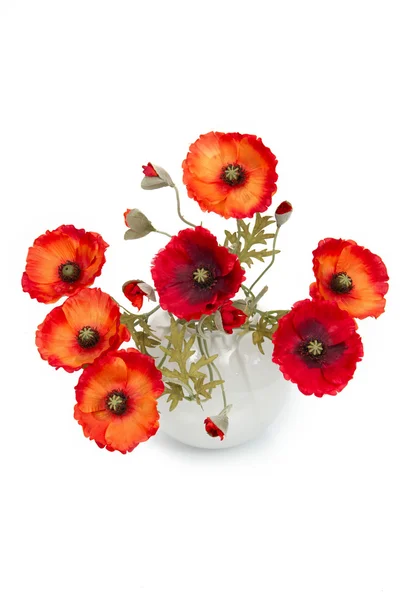 stock image The image of a bouquet of artificial poppies in a vase, isolated