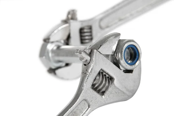 The image of a wrench with a nut, isolated, on a white backgroun — Stock Photo, Image