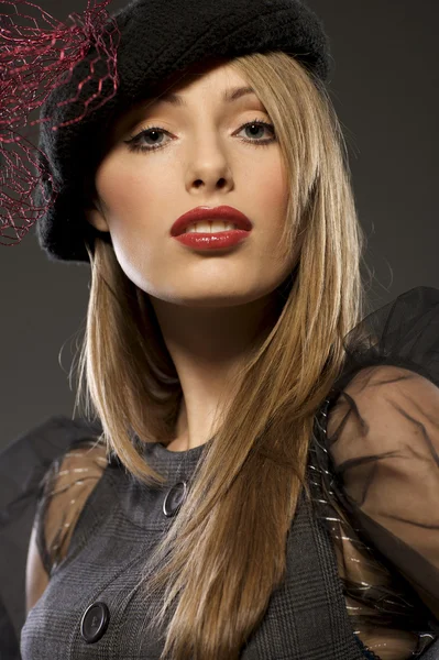 Elegant fashionable woman in a hat — Stock Photo, Image