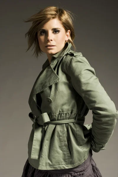 Beautiful Blonde Girl Wearing Green Coat Mini Skirt Grey Background — Stock Photo, Image