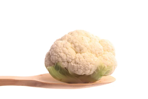 Mini cauliflower on a wooden spoon — Stock Photo, Image