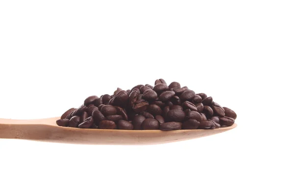 Coffee beans on a wooden spoon — Stock Photo, Image