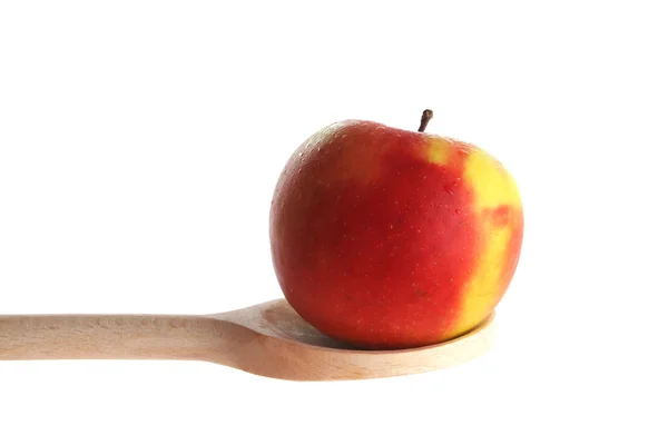 Apple op een houten lepel — Stockfoto