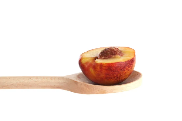 Tangelo on a wooden spoon — Zdjęcie stockowe