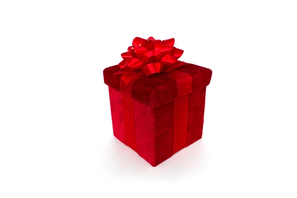 Červená dárková krabička s lukem a stuha — Stock fotografie