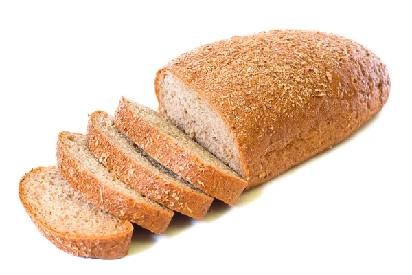 Loaf and slices of whole rye bread — Stock Photo, Image