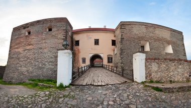 Spring Zolochiv castle bridge gate view (Ukraine) clipart