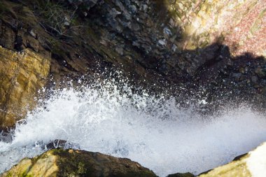 Waterfall on mountain forest clipart