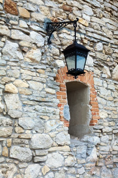 Stony wall with window and lamp (Olesko Castle, Ukraine) — Stock Photo, Image