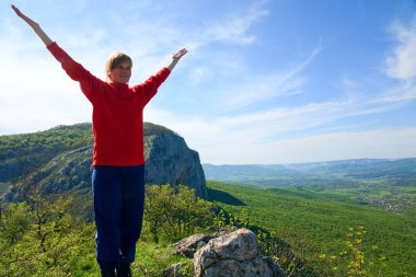 Spring Crimea Mountain landscape and tourist on top(Ukraine). clipart