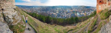 Spring panorama view of Kremenets town from fortress ruins (Ternopil Oblast, Ukraine). Five shots stitch image. clipart