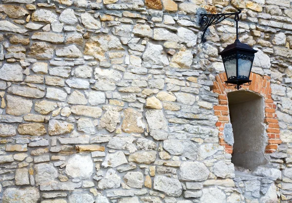 Stony wall with window and lamp (Olesko Castle, Ukraine) — Stock Photo, Image