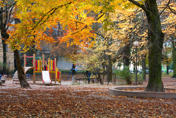 Autumn park and children's playground