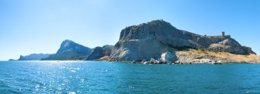 Genoese fortress and summer rocky coastline (Crimea, Ukraine) clipart