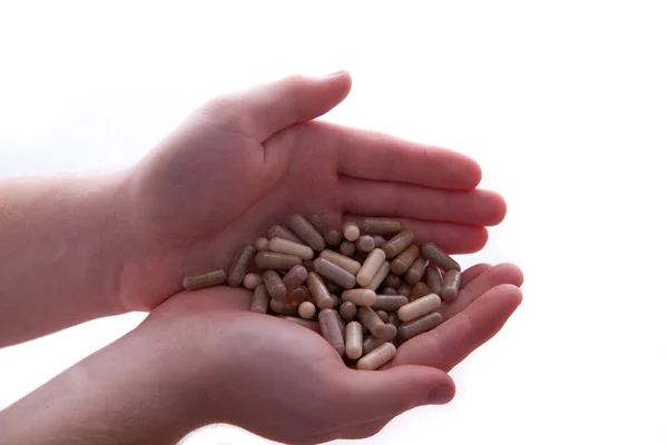 Kéz tele vitaminokkal — Stock Fotó
