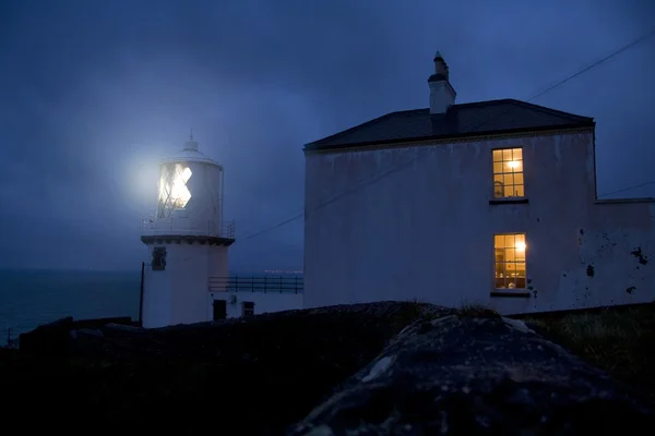 Irish lighthouse and houses — Stock Photo, Image