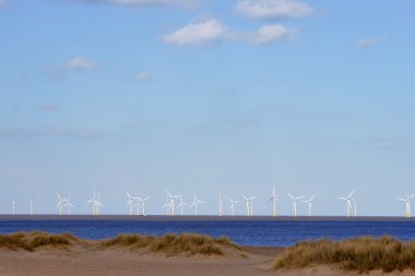 Beach and offshore wind farm clipart