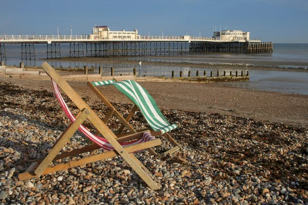 Deckchairs and pier — Stock Photo, Image