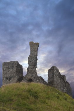 Moody sky over Okehampton castle in Devon clipart