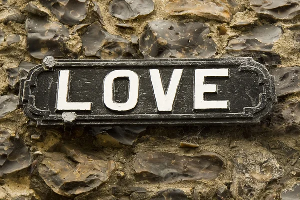 stock image Romantic sign on a flint wall background