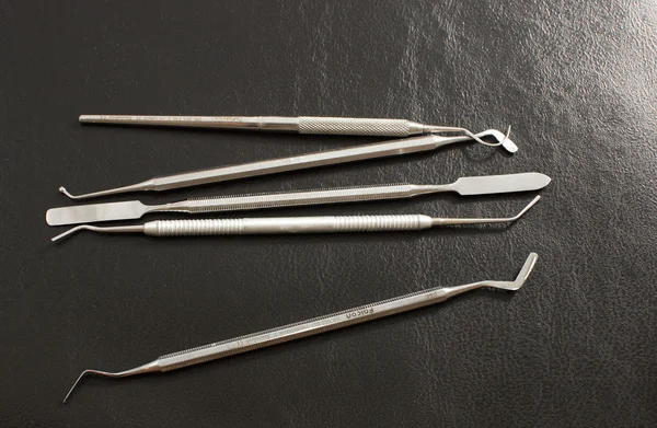 stock image Set of metal medical equipment tools for teeth dental care .