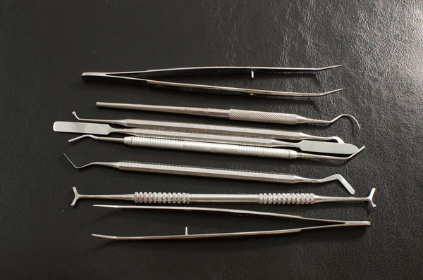 stock image Set of metal medical equipment tools for teeth dental care .