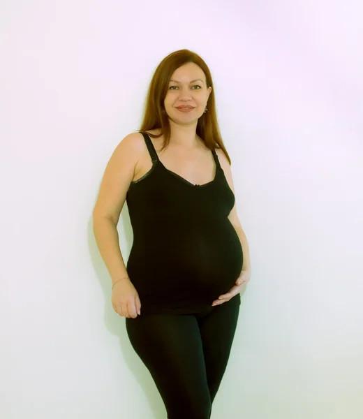 stock image Happy pregnant woman touching her belly .