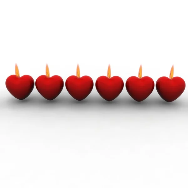 Свечи красных сердец — стоковое фото